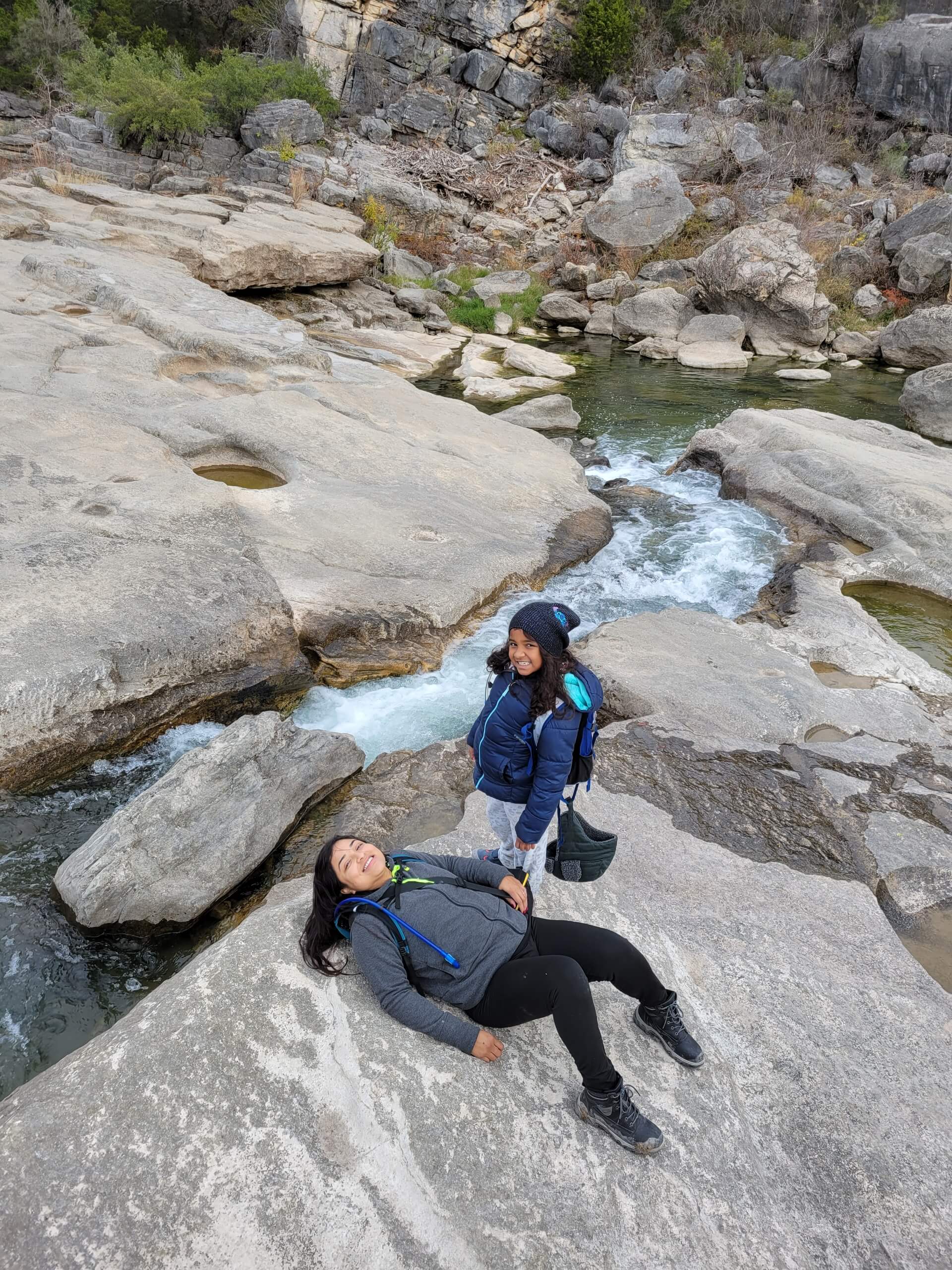 My wife and daughter by on the wall by the camp site.